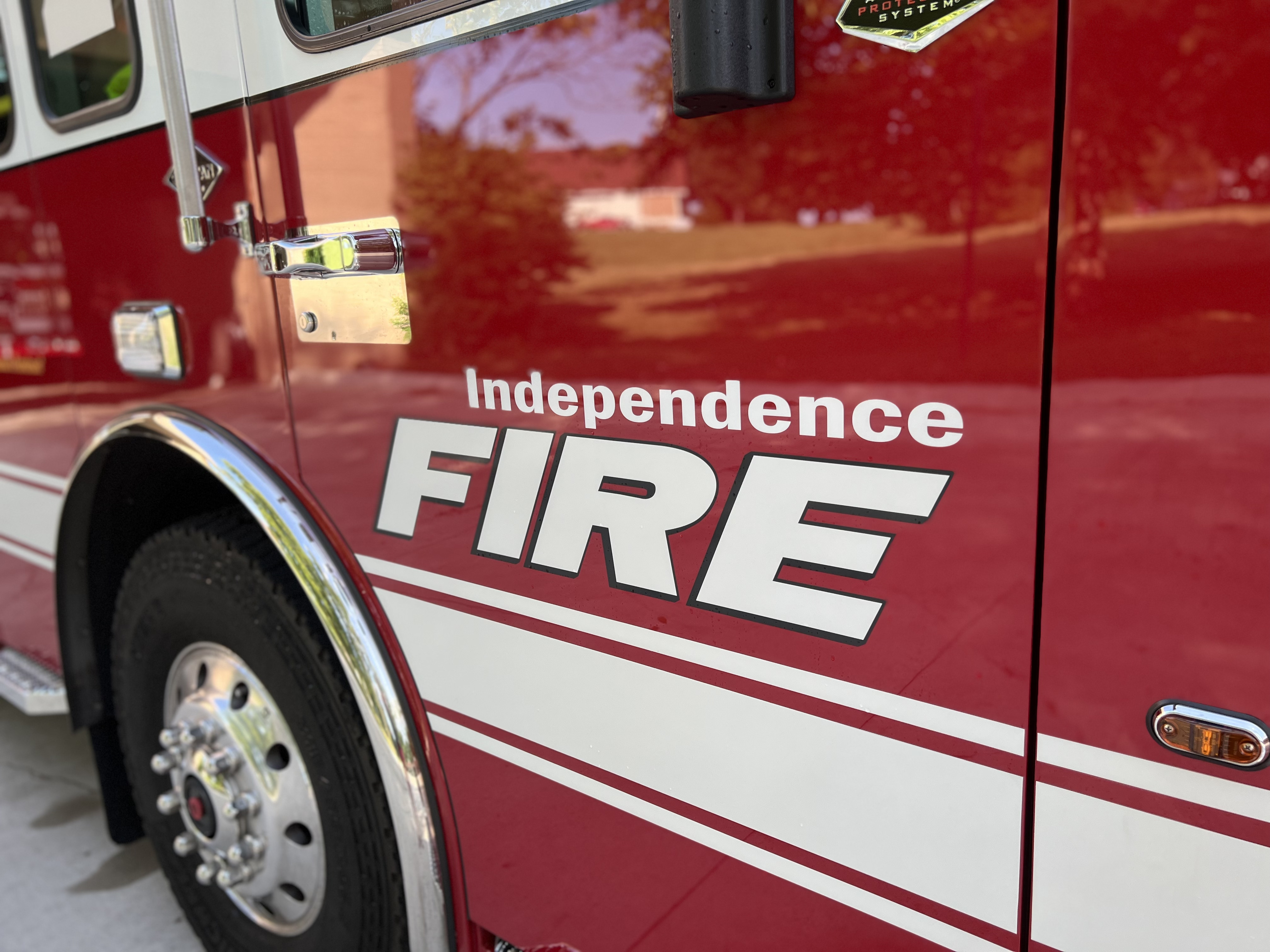 Independence Fire printed in white on the side of a red fire engine