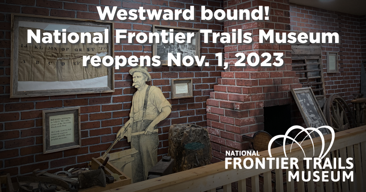Image of the National Frontier Trails Museum blacksmith section with brick wall and cutout figure. 