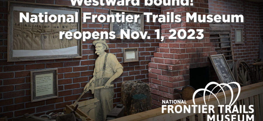 Image of the National Frontier Trails Museum blacksmith section with brick wall and cutout figure. 