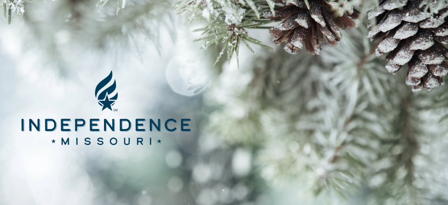 Image of pine needles, pinecones, and snow with the City of Independence blue logo