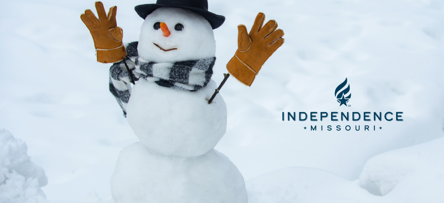 Image of a snowman with a hat, gloves, and scarf with the Independence logo on the right.