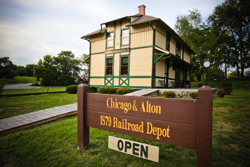 A front view of the Chicago & Alton Depot and the corresponding sign 