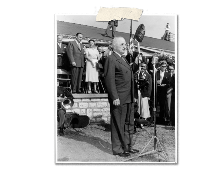 Harry S. Truman holds shovel in his hand and gives speech. Ceremony for the Presidential Library dedication