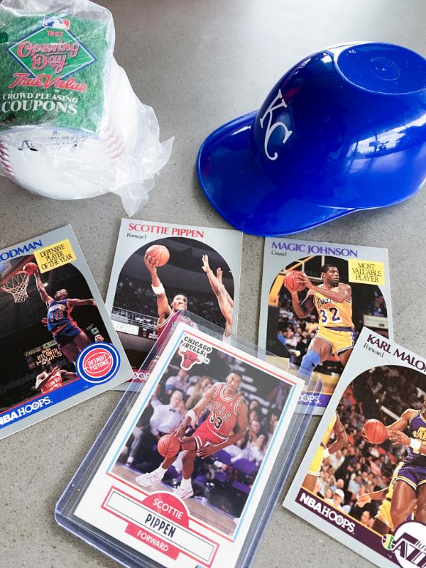 Image of KC Royals collectible hat and basketball trading cards. 