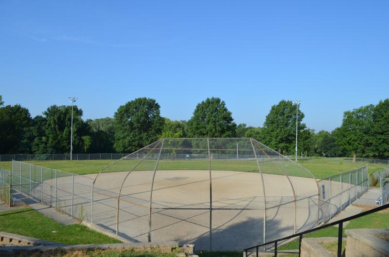An image of a dirt baseball field diamond with a fence around it at Santa Fe Park.