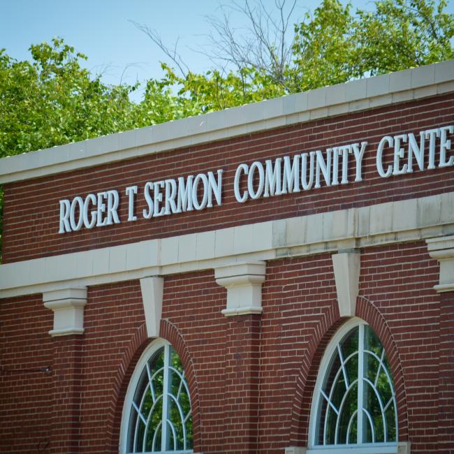 A close view of the sign of the Roger T. Sermon center.