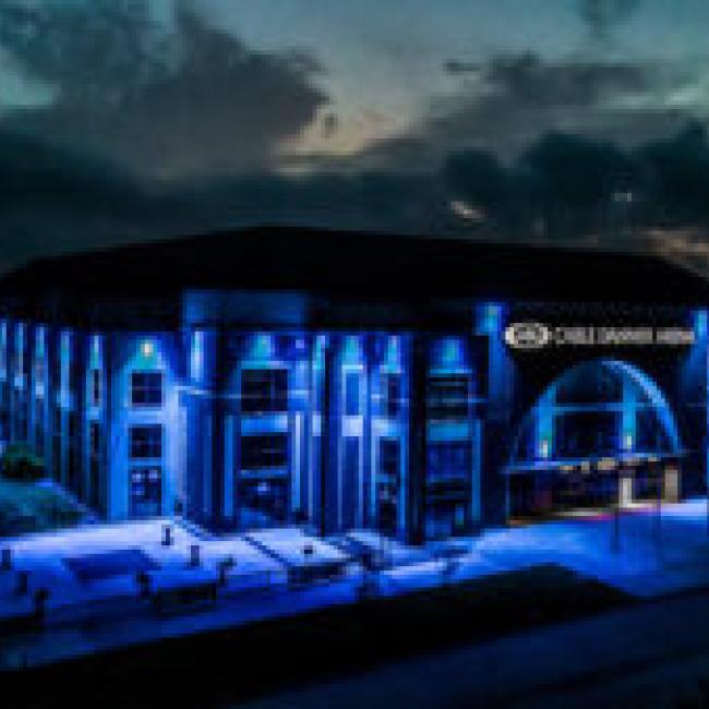 Cable Dahmer Arena as viewed at night and lit up with blue lights