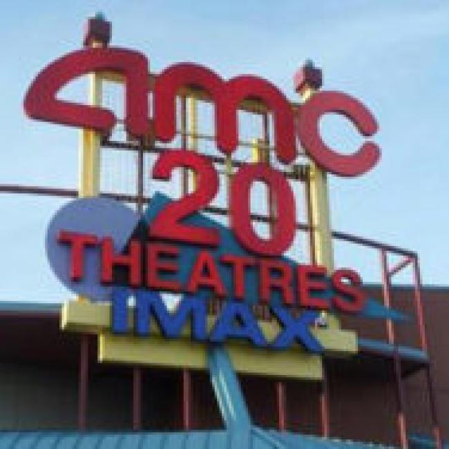 The exterior sign of AMC Commons 20 movie theater in Independence, MO